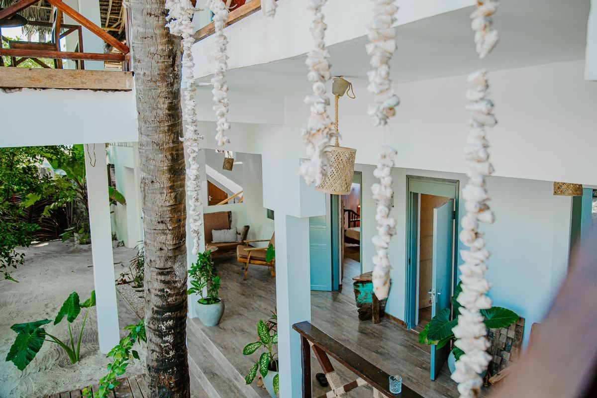 Terrace with strings of seashells hanging between white columns